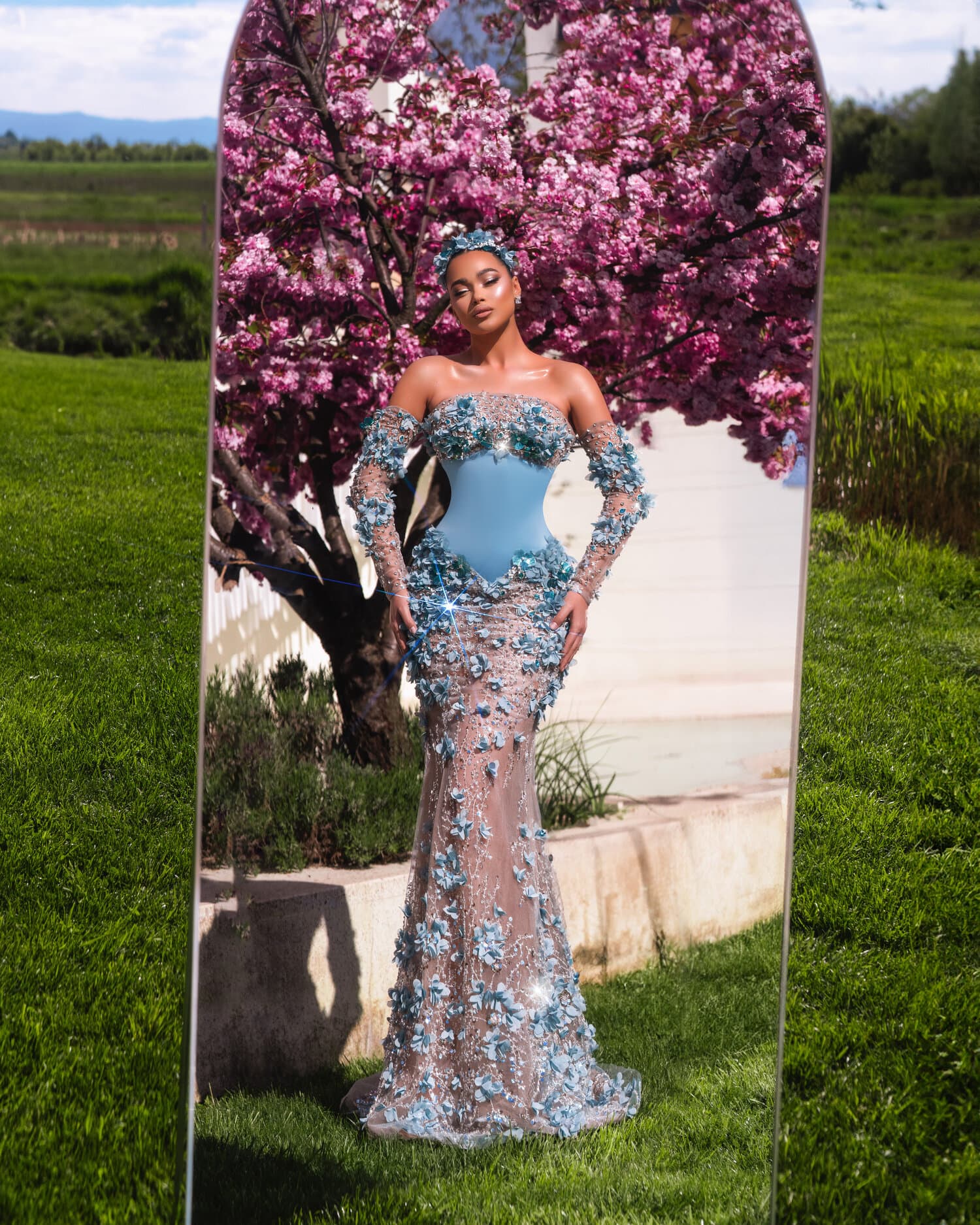 CIELLA — full silhouette in mirror frame against cherry blossoms