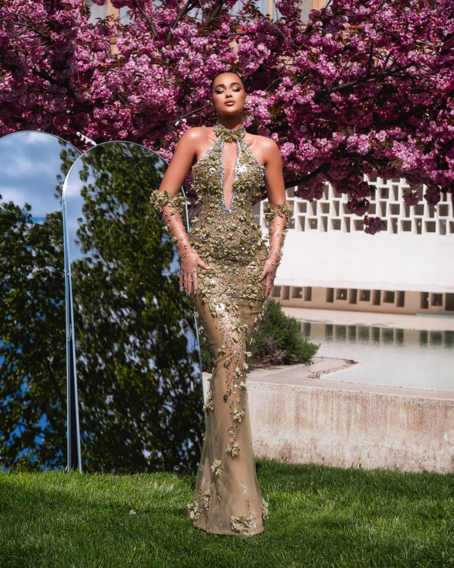 LIRIA — full champagne mermaid silhouette with cape against cherry blossoms
