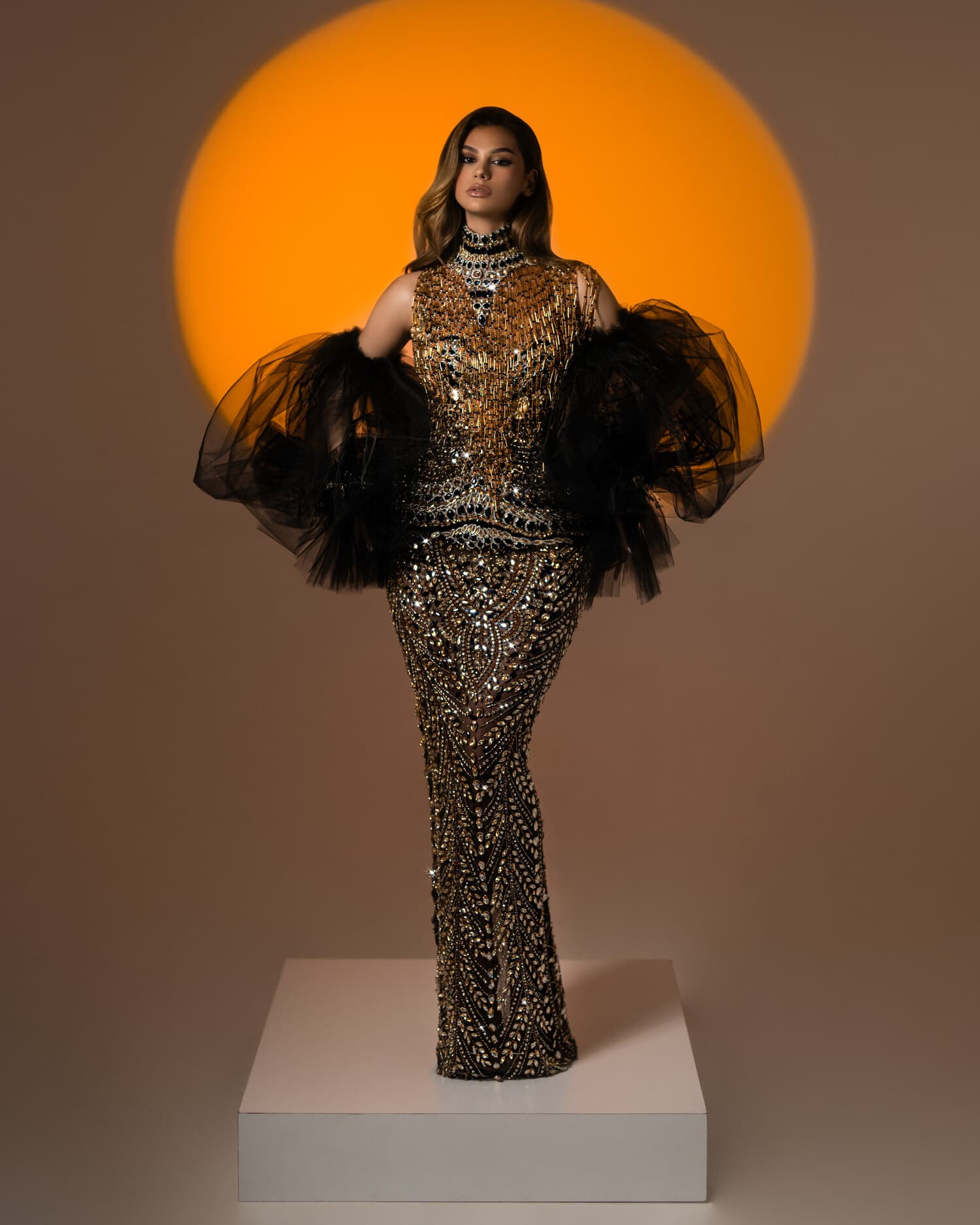 DORÉA — antique-gold sequin mermaid with feather sleeves, ÉCLAT collection by BLINI