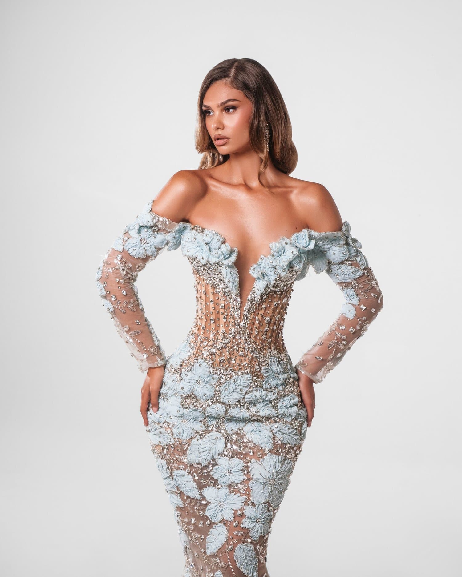 CRISTALLINE — Long-sleeve illusion mermaid with a deep-V neckline, ice-blue petals gathering a