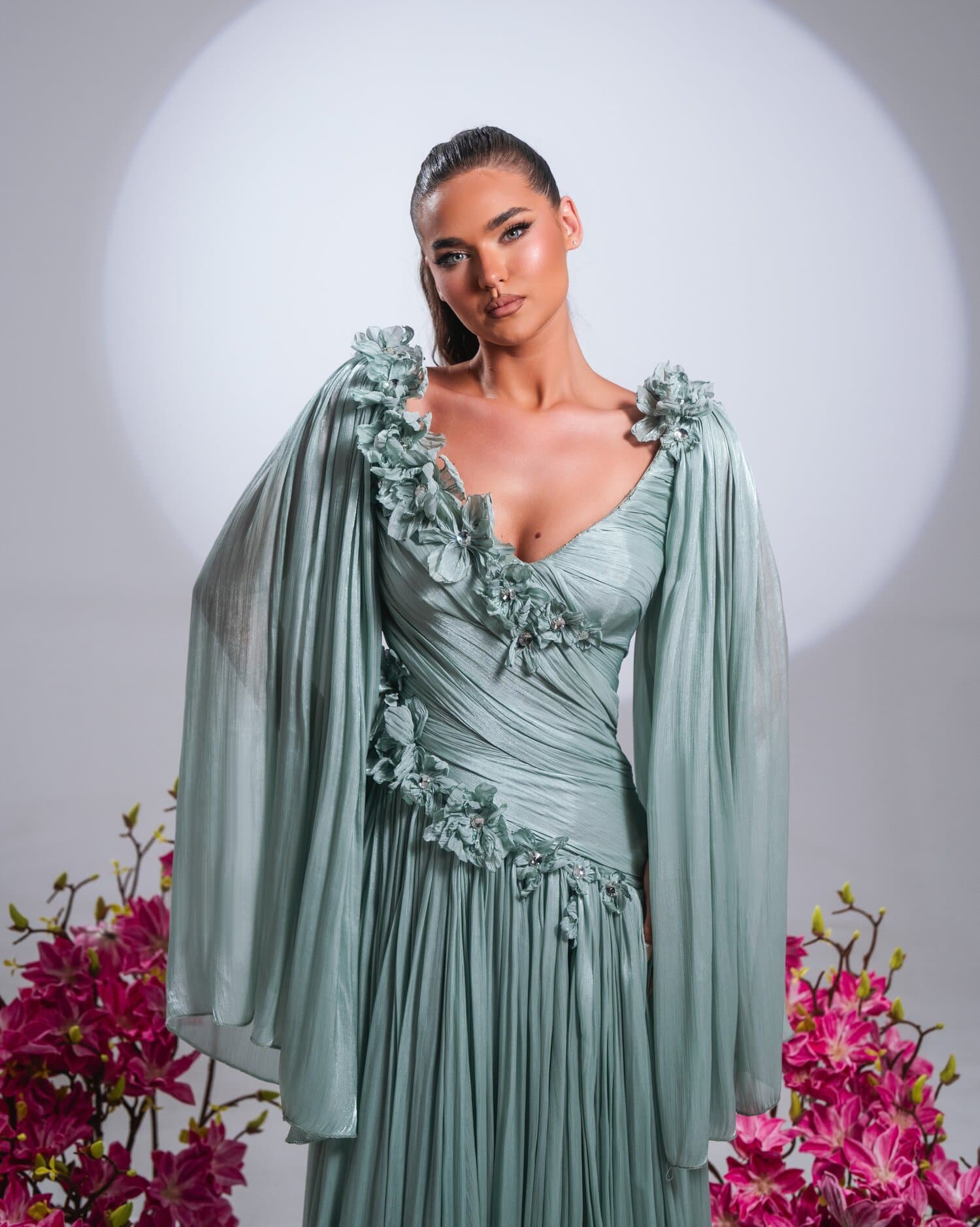 SALVIA — sage-green gown with petal neckline and chiffon wing sleeves, FLEURA collection by BLINI