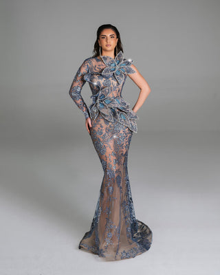 Sheer evening dress featuring intricate floral details and sequins.