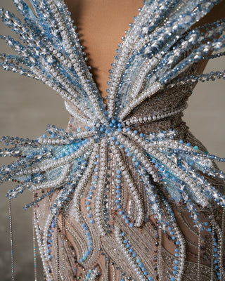 Close-up of the Aera Long Dress showcasing intricate butterfly details.