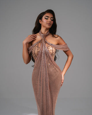 Rose gold gown with shimmering stones and halter neckline.