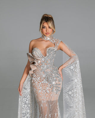 Sculpted one-shoulder dress with intricate leaf design and crystals.