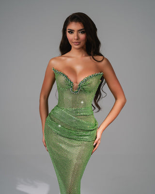 Elegant handmade light green long dress adorned with shimmering stones on the chest, perfect for formal occasions.