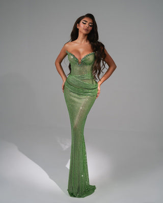 Light green floor-length dress with intricate stone detailing on the bodice, exuding sophistication and grace.