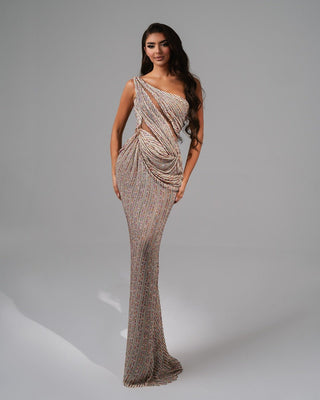 Sparkling asymmetrical dress with a side cutout and floor-length silhouette.