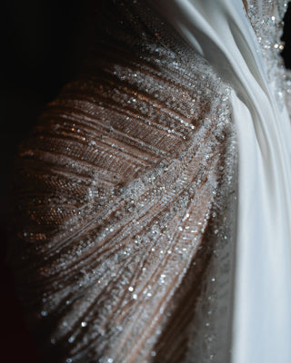 Glamorous one-shoulder dress adorned with crystals, perfect for a bold and sophisticated look.