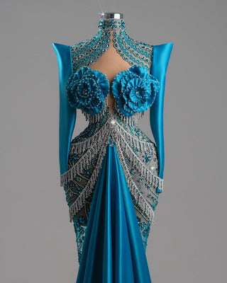 Teal-blue satin gown with silver beading and floral details.