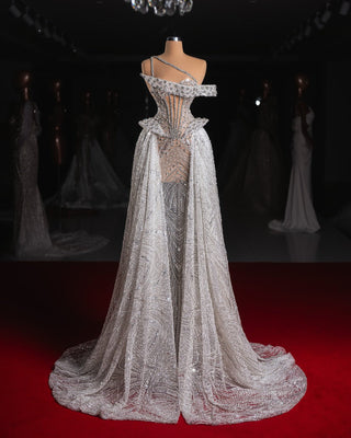 Handmade long wedding gown shimmering with crystal embellishments.