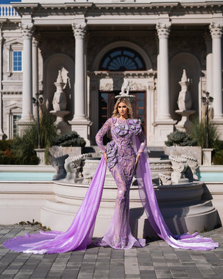 Stunning lavender dress with sheer fabric and floral details.