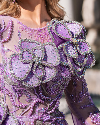 Sophisticated sheer purple gown adorned with flowers.