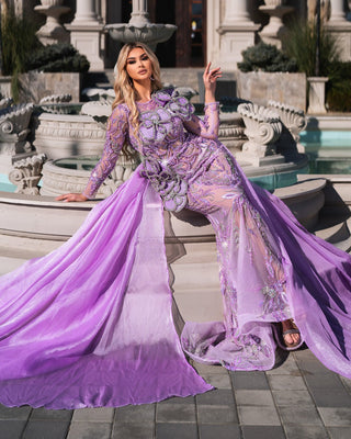 Glamorous purple gown featuring shimmering floral appliqués.