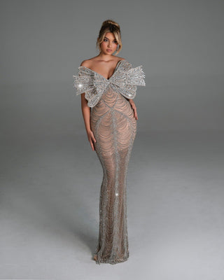 Elegant off-shoulder bridal dress adorned with sparkling butterfly crystals.