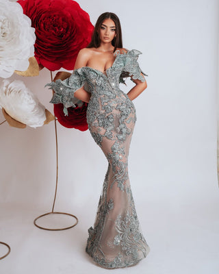 Elegant long off shoulder dress in grey-blue lace for formal occasions.