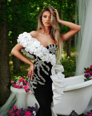 Stunning black dress adorned with intricate white flowers and sparkling silver stones