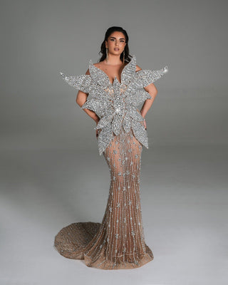 Glamorous silver gown with intricate crystal embellishments and 3D floral details.
