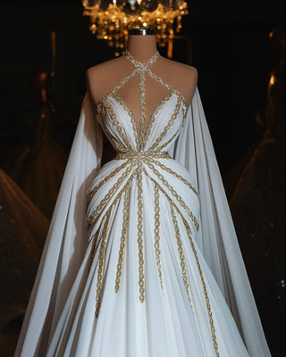 Clementine Bridal Dress featuring a halter neckline and intricate gold embellishments.