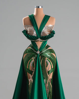 Emerald green gown with crystal details and plunging neckline.