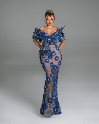 Elegant blue dress with intricate floral and crystal embellishments