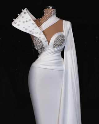 Elegant white bridal dress with 3D crystal and pearl embellishments.