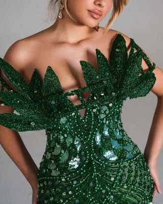 Delilah Emerald gown with bold leaf accents and dazzling details.