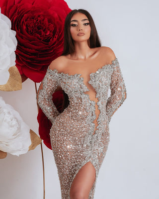 Luxury off shoulder gown in silver with deep cut-out and leg slit