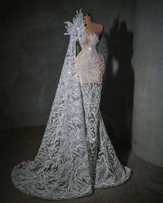 A timeless bridal gown embellished with radiant crystals and pearls, crafted from the finest luxury fabric.