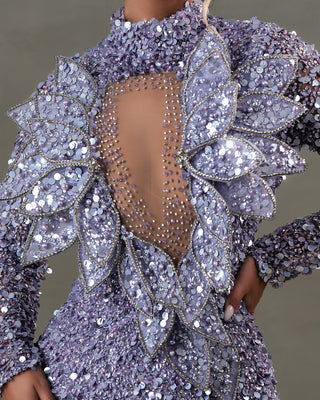 Close-up of 3D leaf embellishments on light purple dress