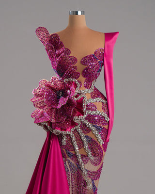 Handmade one-shoulder pink dress with large floral design and crystal accents.