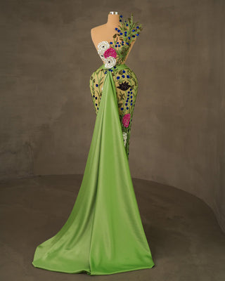 Stylish sleeveless dress in light green with flowers and front tail detail