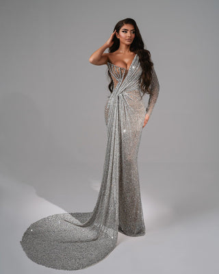 Shimmering asymmetrical dress with crystal embellishments.