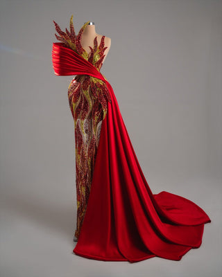 Glamorous dress with red and gold flame details and bold sash.