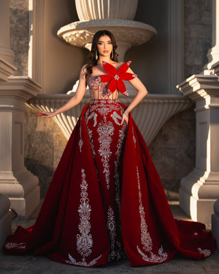 Regal red gown with silver embroidery and crystal embellishments.