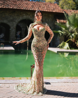 Full-length view of the Makena nude dress with green crystals, highlighting its floor-length design and luxurious handcrafted details.