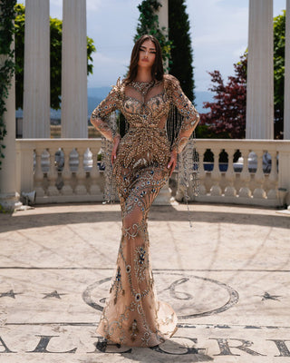 Full-length Mara Nude Dress adorned with shimmering crystal accents.