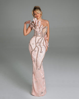 Elegant pink gown with crystal embellishments.