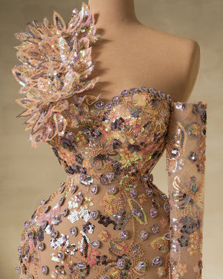 Close-up of sequins and stones on one shoulder dress