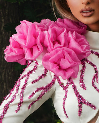 Close-Up of 3D Pink Flowers on White Dress