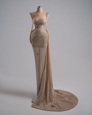 Elegant nude dress with shimmering fabric and a flowing silhouette.