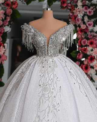 Close-up of the Roselyn Bridal Dress showcasing off-shoulder sleeves and sparkling crystal details on the bodice.