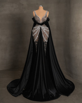 Luxury black dress embellished with silver stones, featuring thin straps and satin details