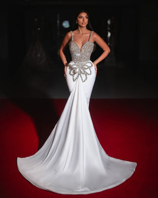 Elegant Sabrina bridal gown with crystal embellishments and a flowing satin silhouette.