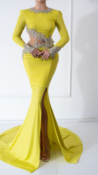 A vibrant yellow dress with long sleeves and crystal embellishments, offering an elegant and glamorous look.