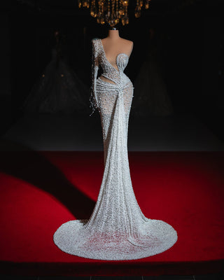 Elegant bridal gown embellished with shimmering crystals and delicate pearls for a luxurious look.
