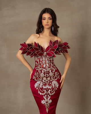 Dark red satin off-shoulder gown.