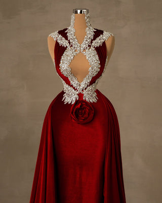 A luxurious red velvet dress, draped elegantly.