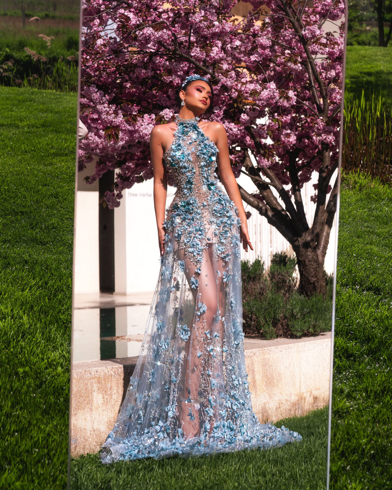 MIRELLA — full silhouette in mirror frame against cherry blossoms