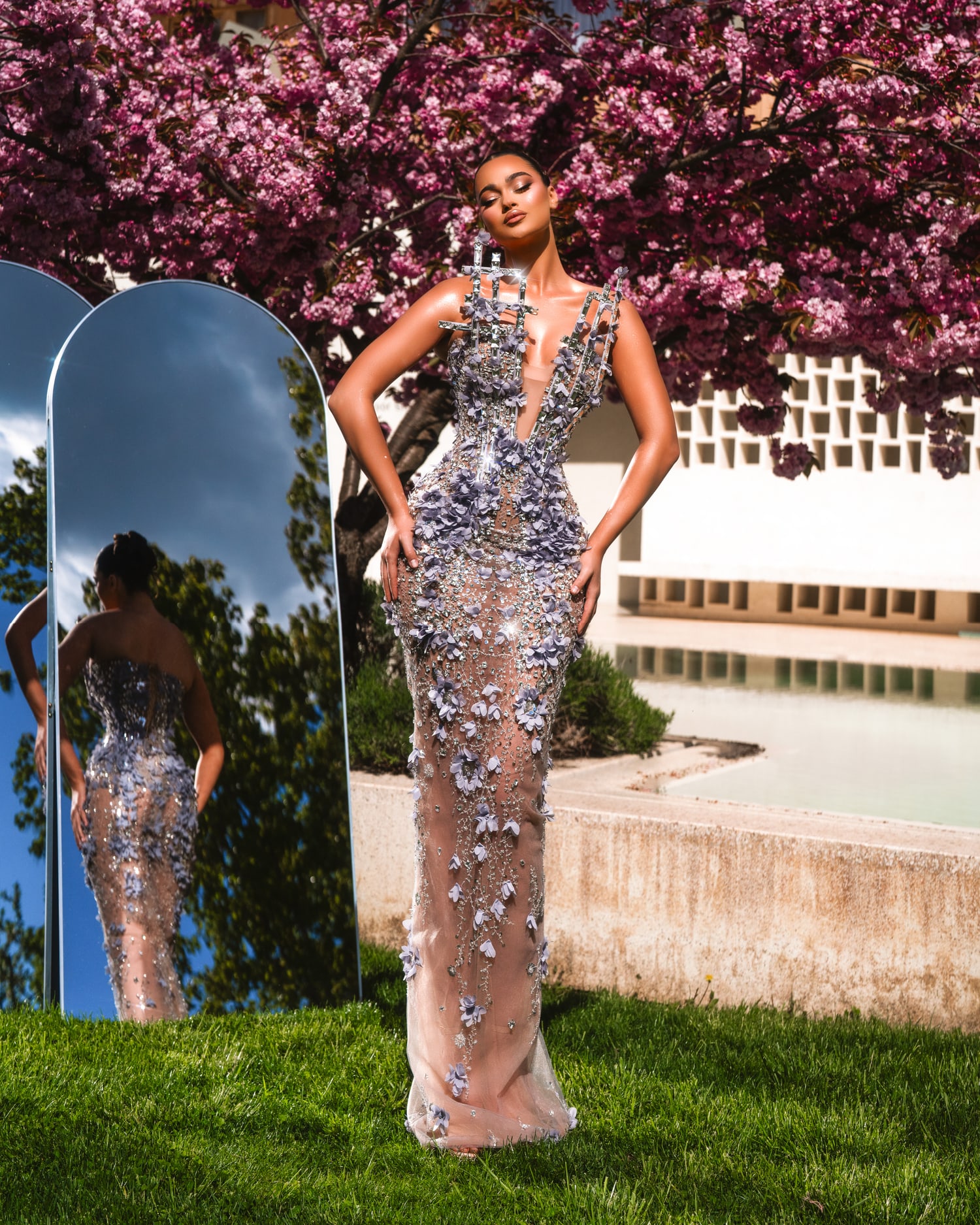 VESPERA — full architectural crystal mermaid silhouette against cherry blossoms